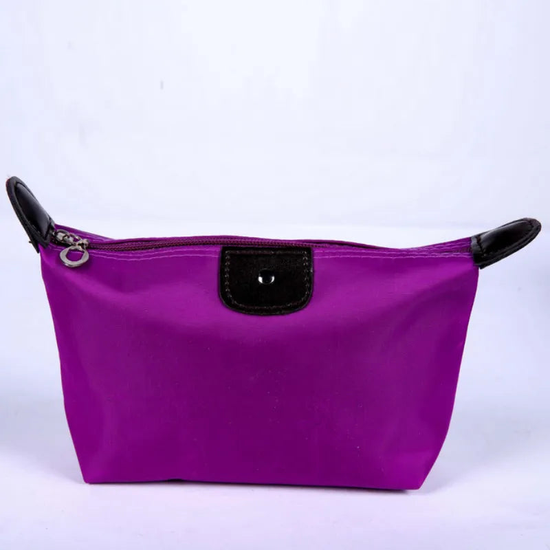 Waterproof Nylon Cosmetic Bag For Women, Cute Dumpling Shape, Zipper Makeup Travel Pouch shown in a compact solid-color design