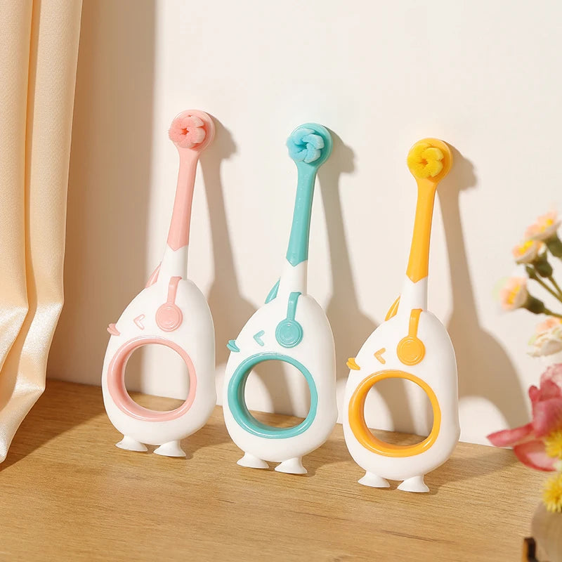 Baby Toothbrush For Infants And Toddlers 0-3, Small Head, Cartoon Handle, Suction Cup Base standing upright on its suction cup storage base
