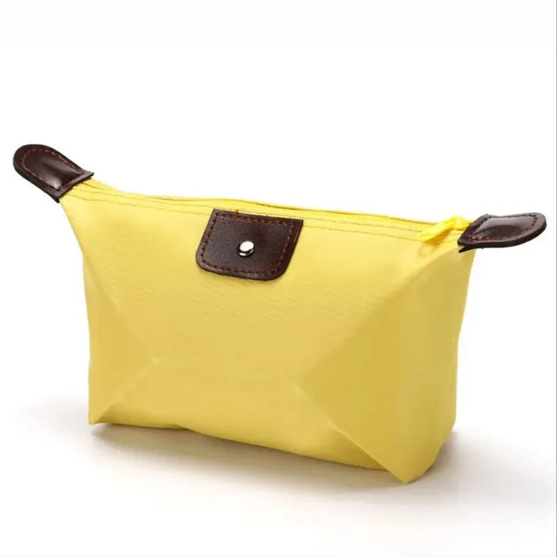 Waterproof Nylon Cosmetic Bag For Women, Cute Dumpling Shape, Zipper Makeup Travel Pouch shown in a compact solid-color design
