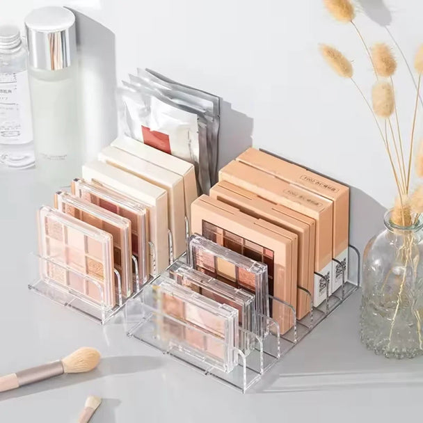 7-Compartment Makeup Organizer, Clear Eyeshadow Palette Storage Rack For Desktop Or Drawer in a clear plastic design