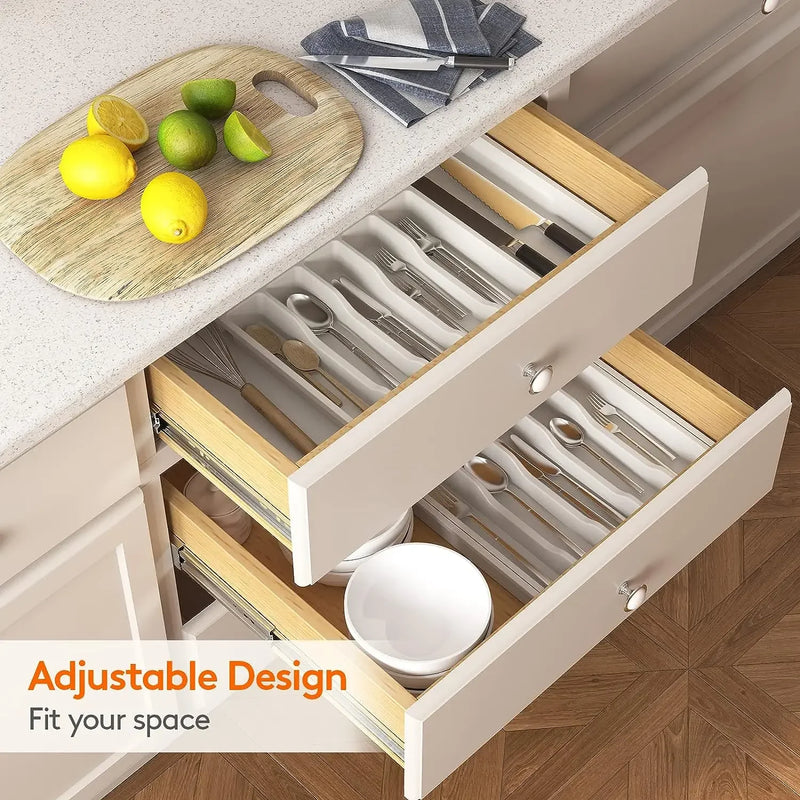 Expandable Kitchen Drawer Organizer, Adjustable 6-8 Compartment BPA-Free Utensil Tray organizing spoons, forks, knives, and flatware in a kitchen drawer