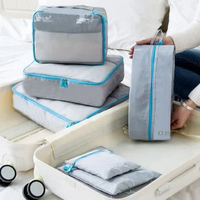 7-Piece Travel Packing Cubes Set, Waterproof PVC Luggage Organizer Bags For Clothes And Shoes arranged for clothes, shoes, and travel accessories