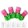 4-Piece Cute Pet Dog Socks, Printed Non-Slip Cat Shoes, Warm Polyester Paw Protectors shown as a cute cartoon pet sock set