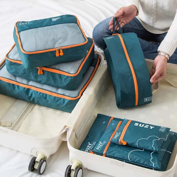 7-Piece Travel Packing Cubes Set, Waterproof PVC Luggage Organizer Bags For Clothes And Shoes shown together for organized suitcase packing