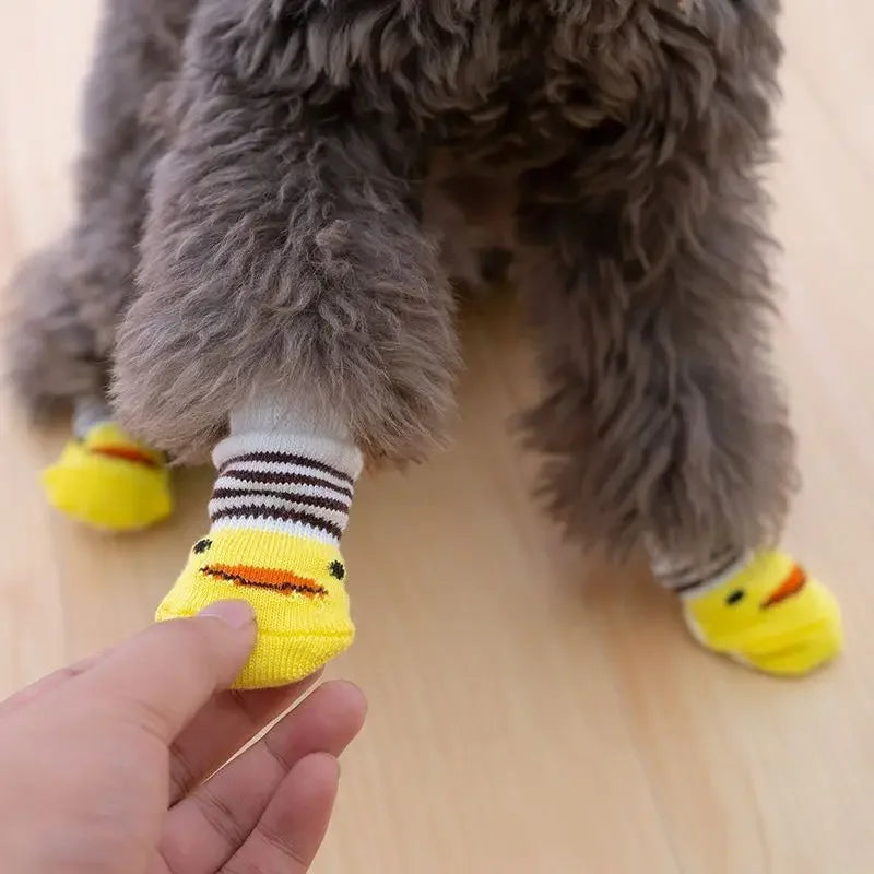 4-Piece Cute Pet Dog Socks, Printed Non-Slip Cat Shoes, Warm Polyester Paw Protectors showing soft knitted polyester fabric