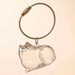 Pet Hair Memorial Keychain, Cat-Shaped Resin Storage Capsule For Cat And Dog Fur Keepsake attached to a portable key ring