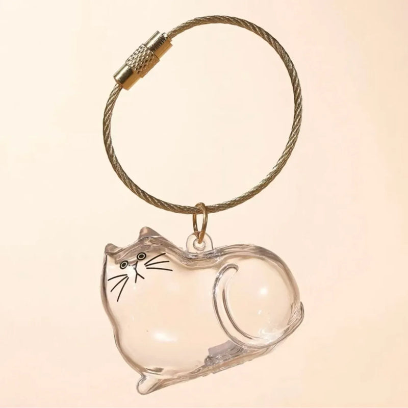 Pet Hair Memorial Keychain, Cat-Shaped Resin Storage Capsule For Cat And Dog Fur Keepsake attached to a portable key ring