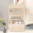Waterproof Hanging Travel Makeup Bag, Foldable Toiletry Organizer With Hook displayed closed for compact travel storage