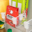 4/8Pcs Adjustable Refrigerator Storage Dividers, Plastic Fridge Separators For Bottles And Cans shown organizing bottles and cans on a refrigerator shelf