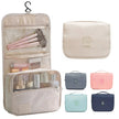 Waterproof Hanging Travel Makeup Bag, Foldable Toiletry Organizer With Hook shown open with multiple compartments for cosmetics, toiletries, and travel essentials