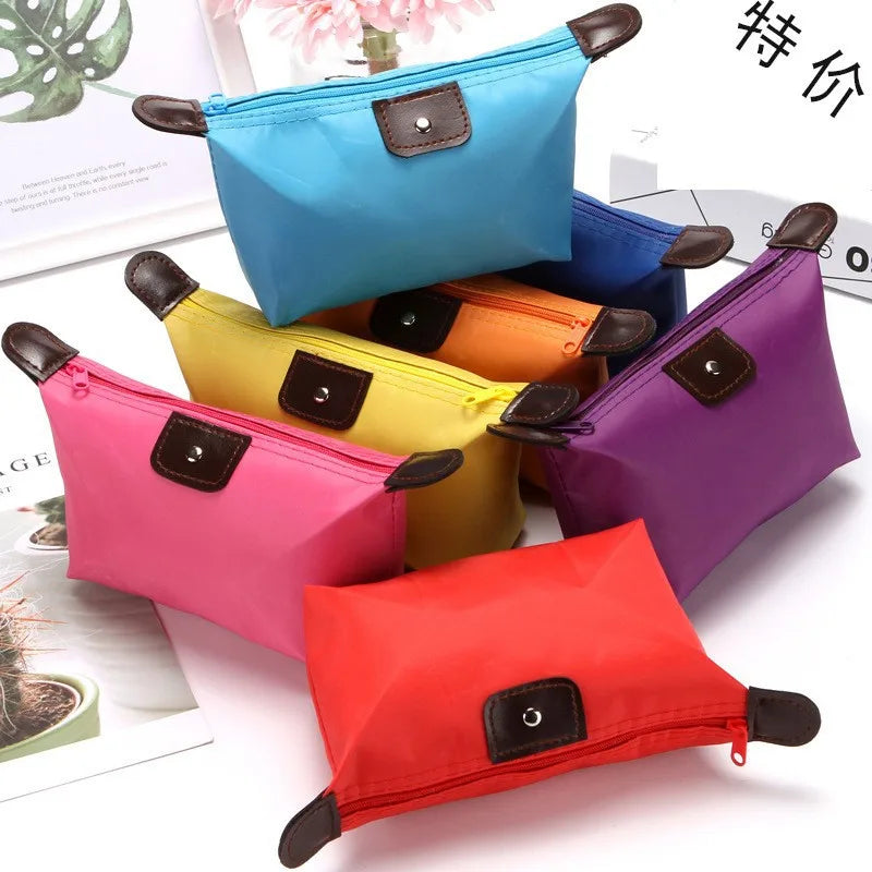 Waterproof Nylon Cosmetic Bag For Women, Cute Dumpling Shape, Zipper Makeup Travel Pouch in a compact soft pillow-inspired design