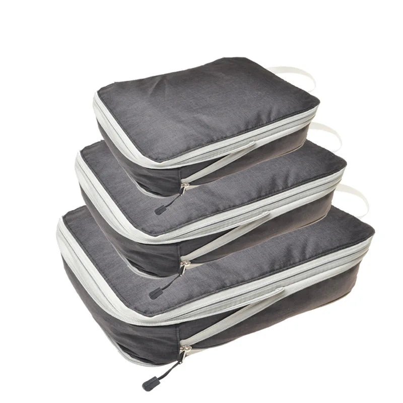 Foldable Compression Packing Cubes, Waterproof Oxford Travel Bags With Handles, Luggage Organizer shown as a compact travel storage bag