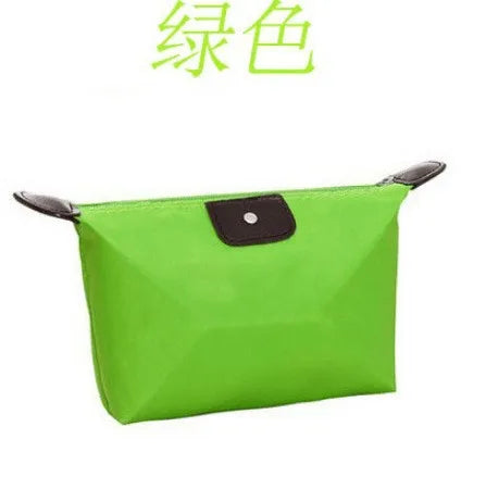 Waterproof Nylon Cosmetic Bag For Women, Cute Dumpling Shape, Zipper Makeup Travel Pouch shown in a compact solid-color design